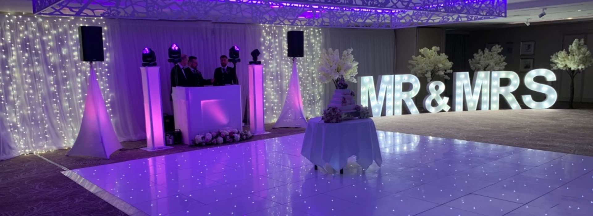 Stunning dance floor at wedding reception with colorful lighting